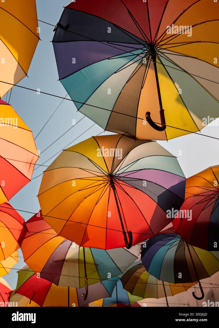 Abstract full-frame overhead pattern layout of overlapping colorful open paper umbrellas, George Town, Penang, Malaysia Stock Photo