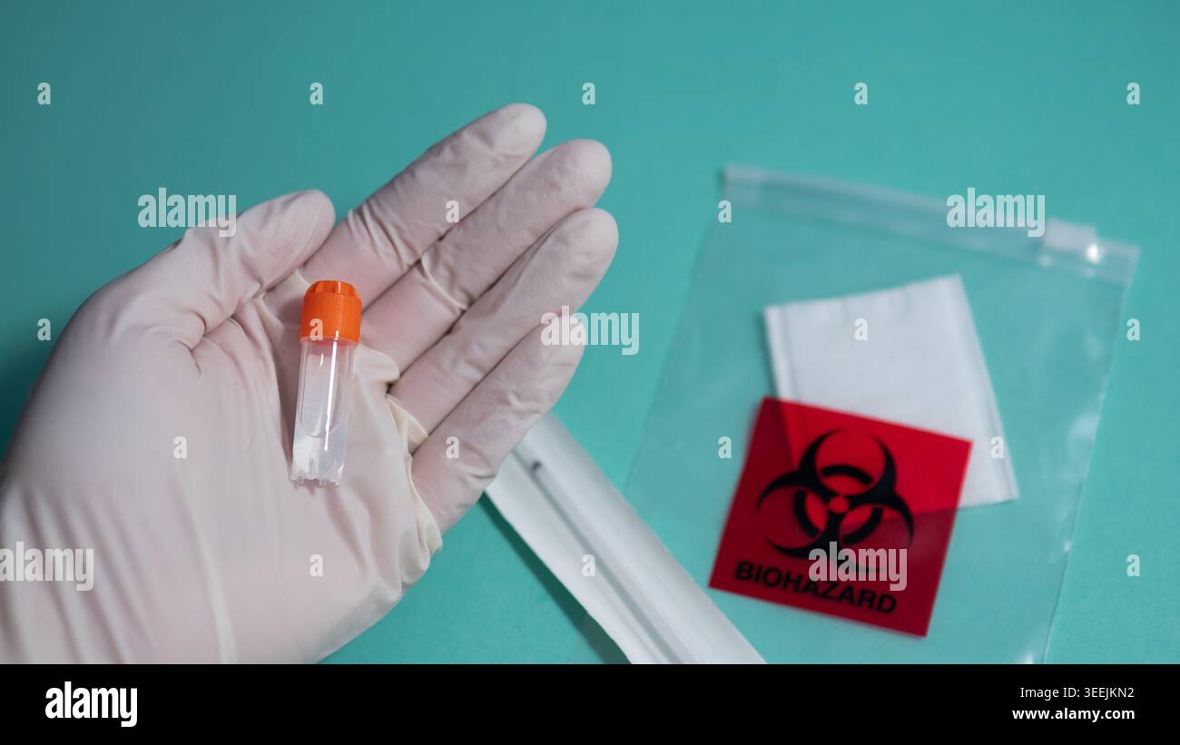 Gloved Hand Presenting PCR Sample Vial with Biohazard Bag — Medical ...