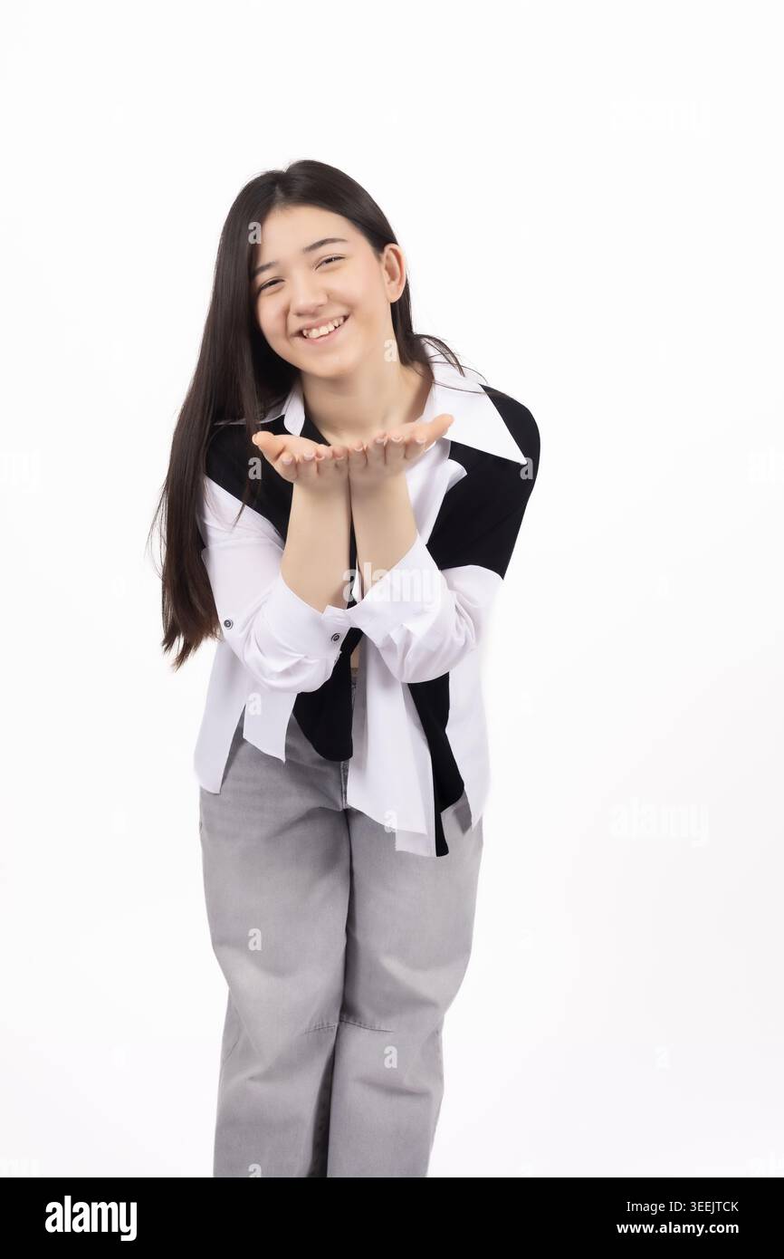 Woman in black and white shirt posing, white background for ...