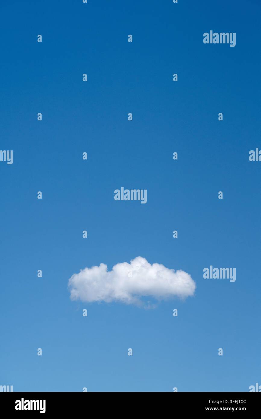 Single cloud in blue sky. Stock Photo