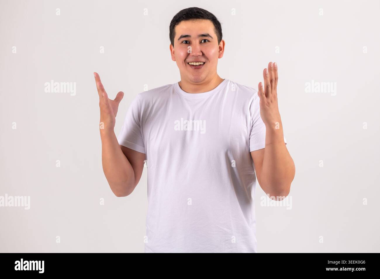 Young man gesturing with hands - looking surprised or explaining something Stock Photo
