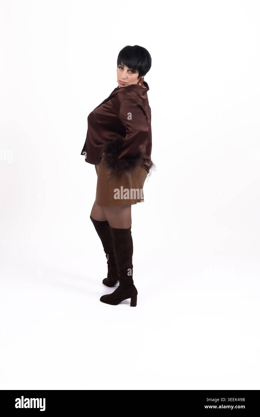 Woman in full length standing and posing against white background Stock Photo