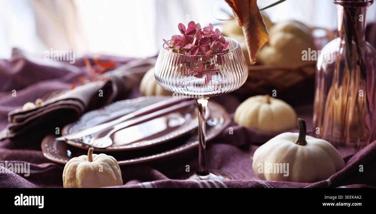Autumn table setting with white pumpkins and rustic decor Stock Photo