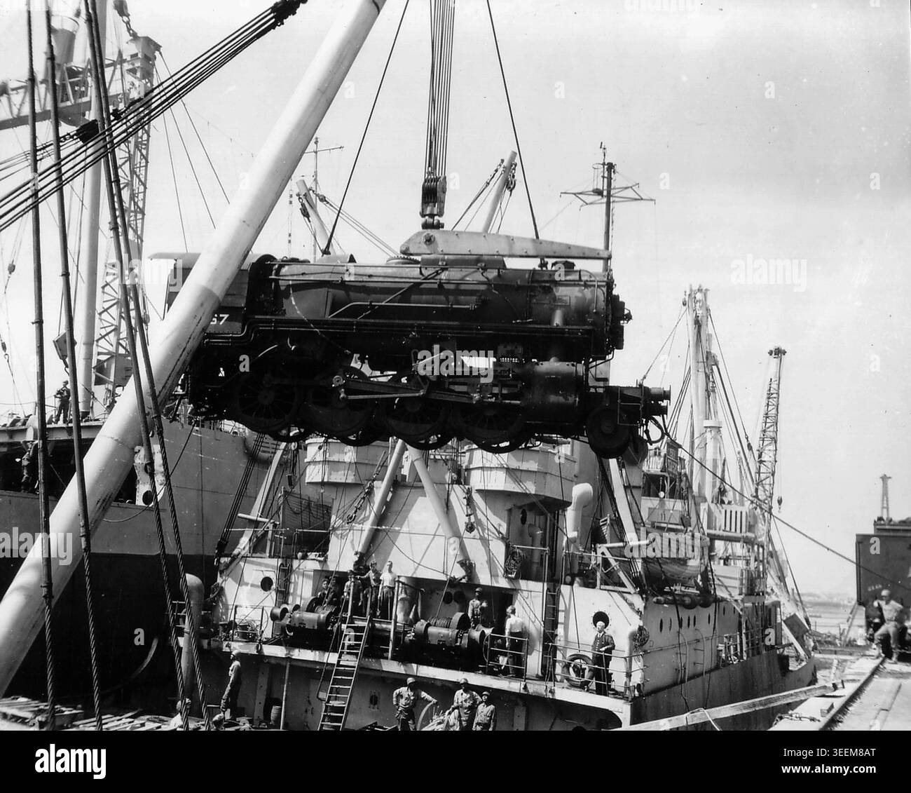 Unloaded Picture A steam locomotive being unloaded from a ship at Cherbourg Stock Photo ...