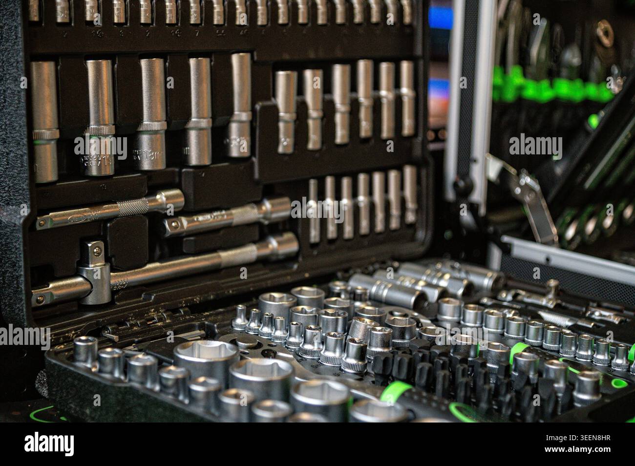 Various tools are arranged in a case, featuring sockets and ratchets for easy access. Stock Photo
