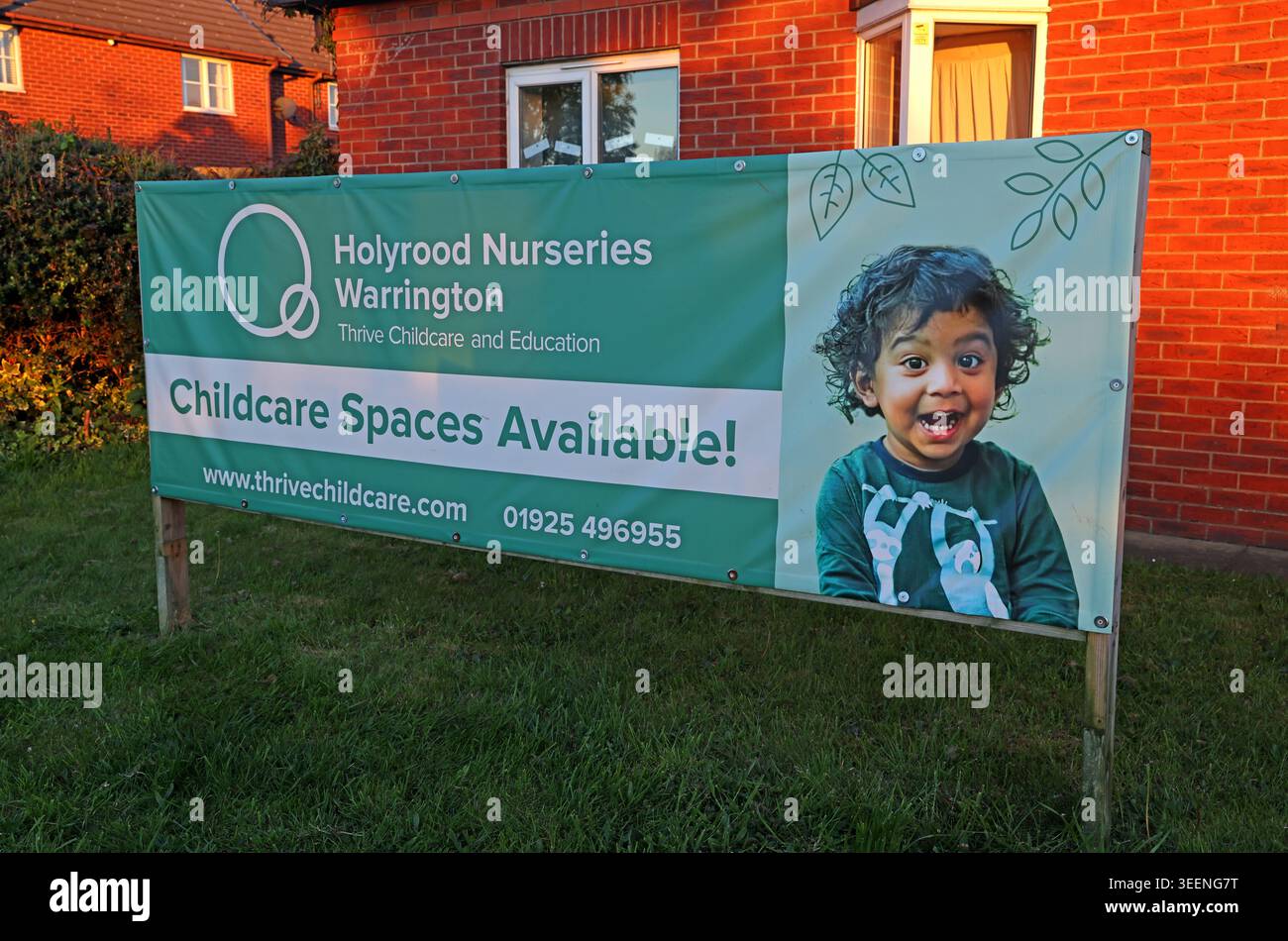Holyrood Nurseries childcare places banner in Thelwall, Warrington, advertising nursery spaces and childcare support Stock Photo