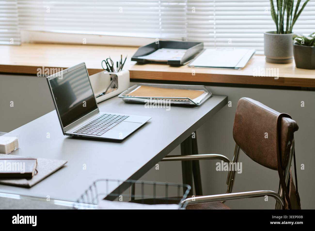 Modern Office Workspace Featuring Laptop for Remote Work Setup Stock Photo