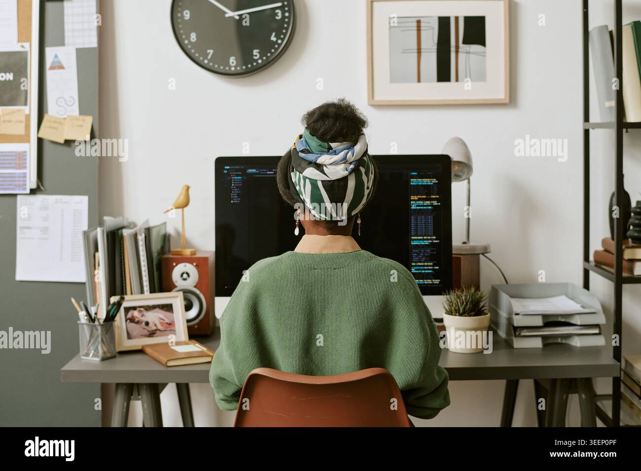 Black Woman Coding at Home Office for Remote Software Work Stock Photo