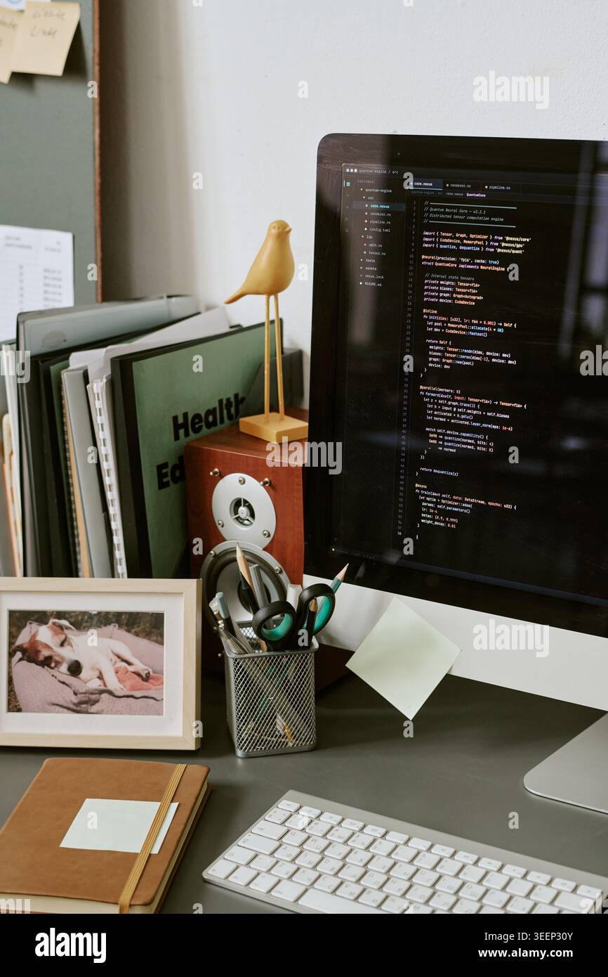 Software Developer Workspace Displaying Code for Web Development Stock Photo