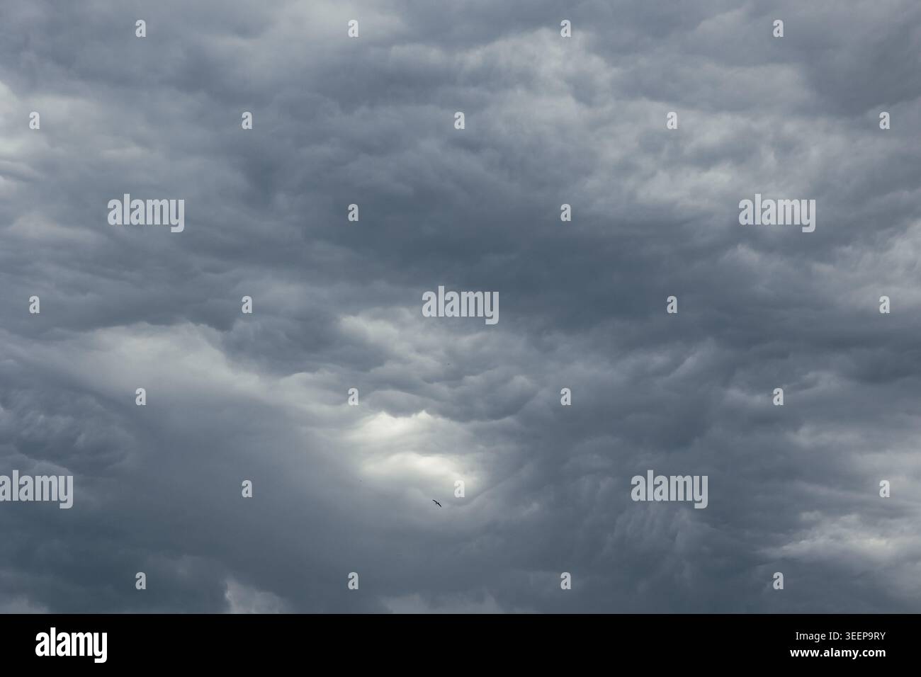 Dramatic dark sky. Heavy gray clouds background photo. Stock Photo