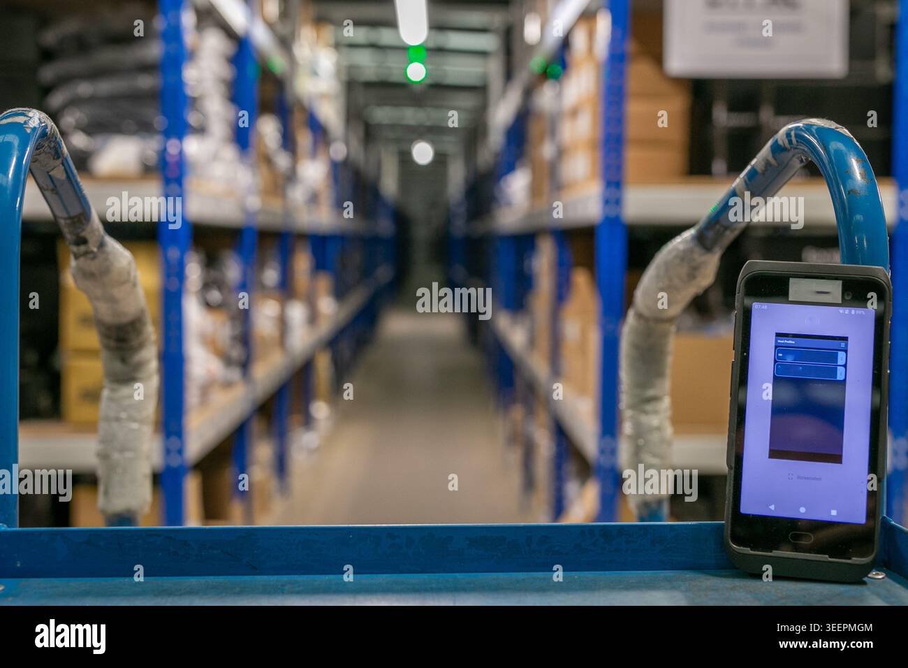 Logistics e-commerce warehouse interior featuring multi-tier shelving ...