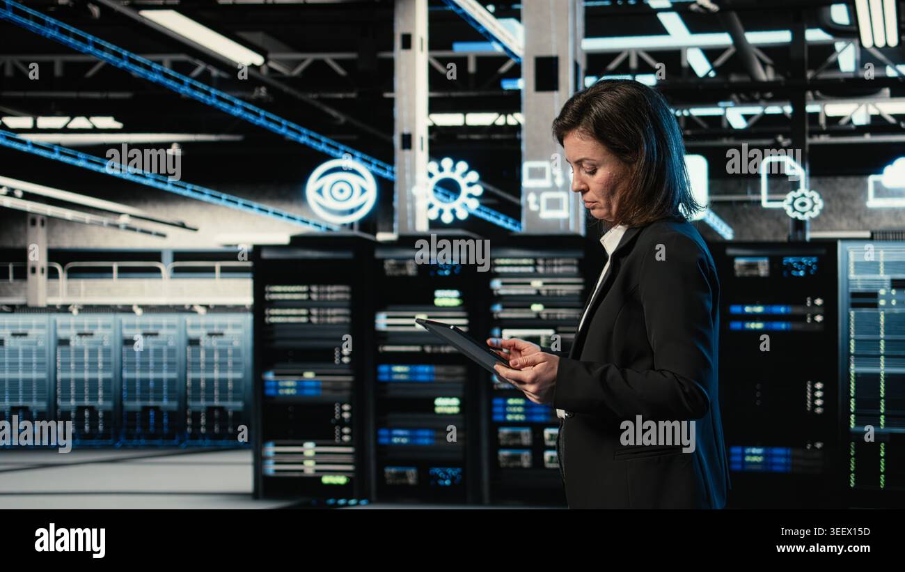 Data center engineer configuring rigs using augmented reality control panel. Woman walking in server farm, interacting with virtual holographic visualization to adjust hardware settings Stock Photo