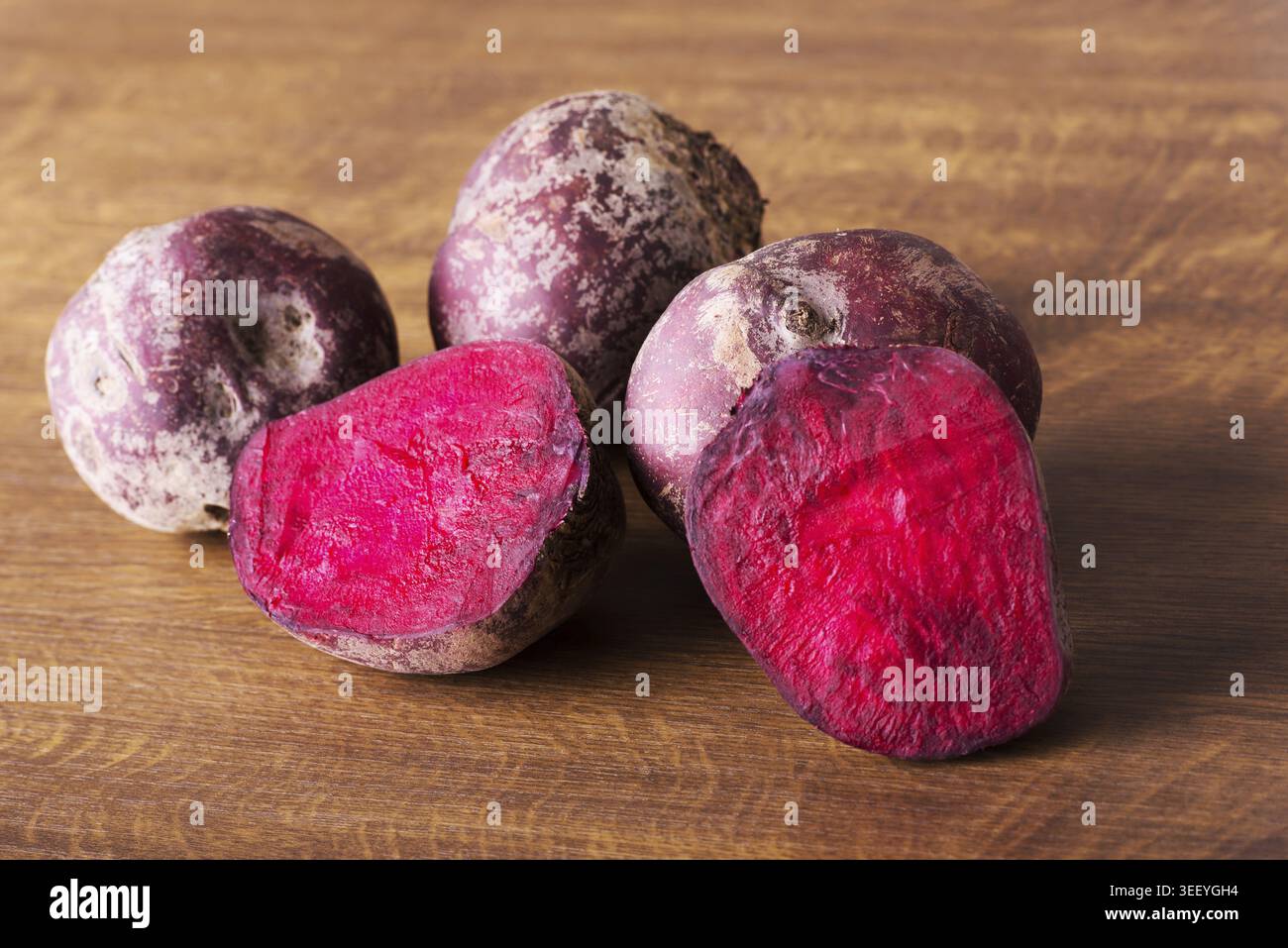 Fresh, raw Beetroots over wooden background Stock Photo