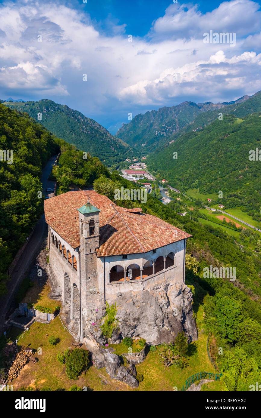 Aerial view of the San Patrizio sanctuary on a hill overlooking Casnigo and Valle Seriana. Val Seriana, Bergamo province, Lombardy, Italy. Stock Photo