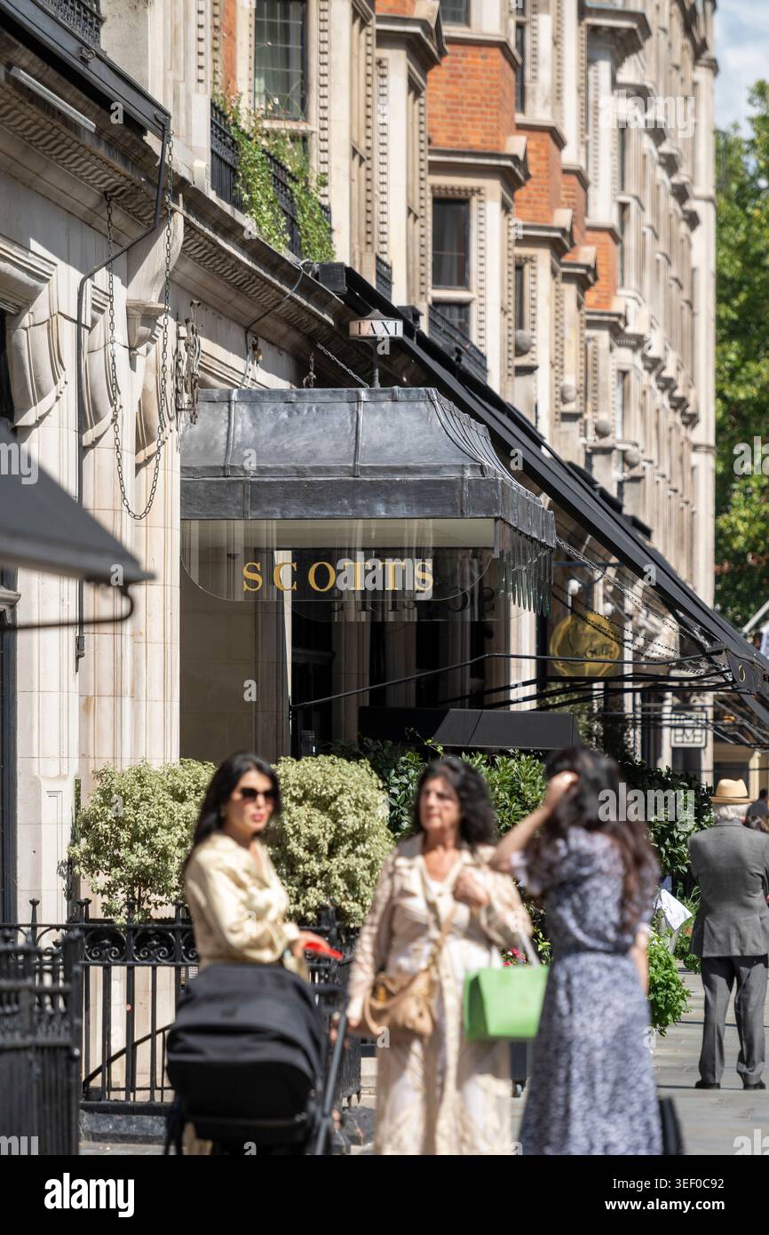 Fashionable women outside Scott's restaurant in Mayfair, London. Stock Photo