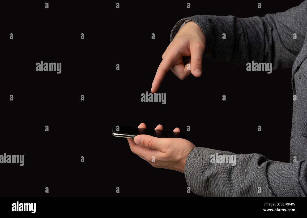 User Interacting With Smartphone Screen in Dark Setting During Evening Hours Stock Photo