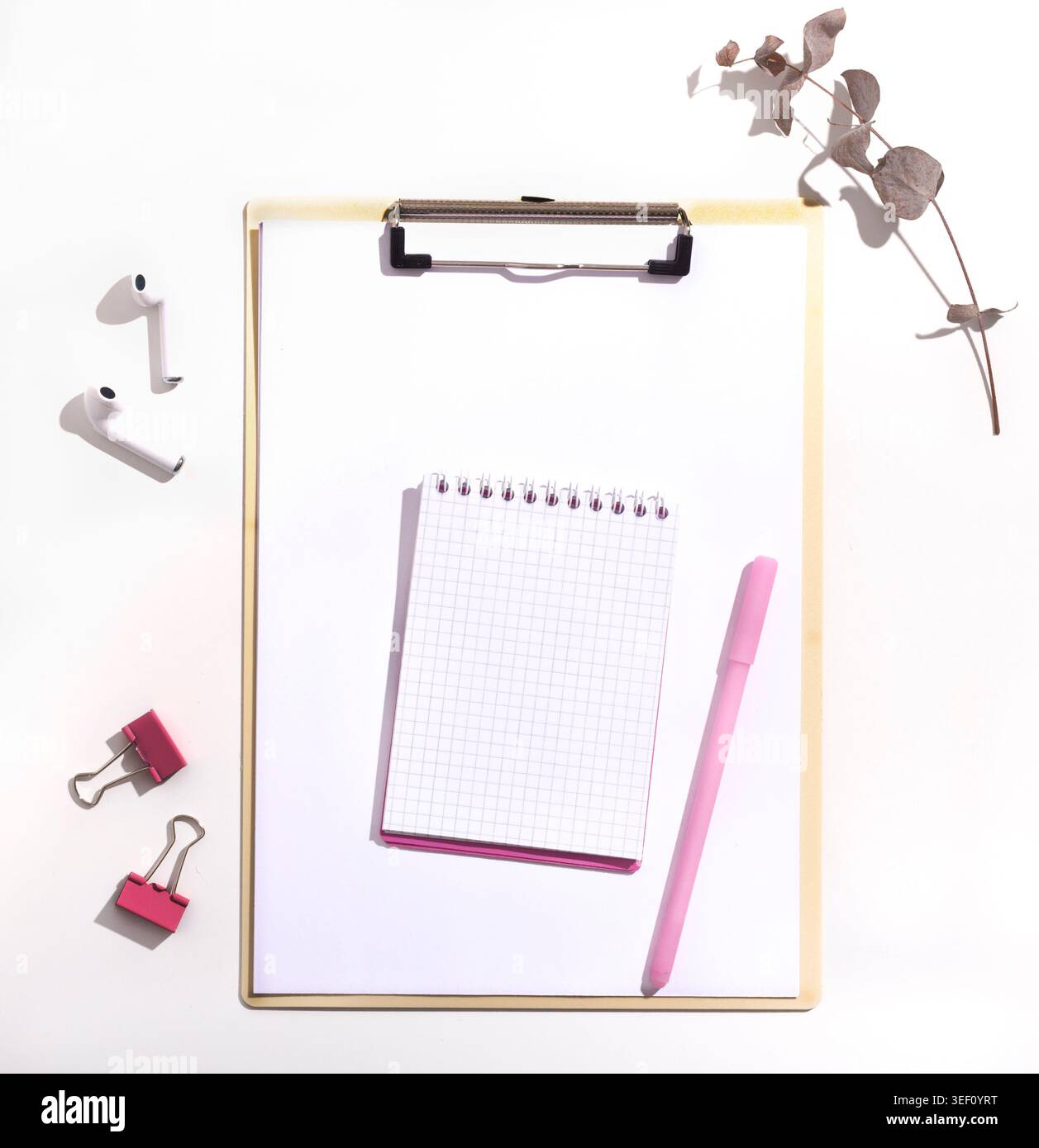 Notepad with blank space and pink pen on white background Stock Photo
