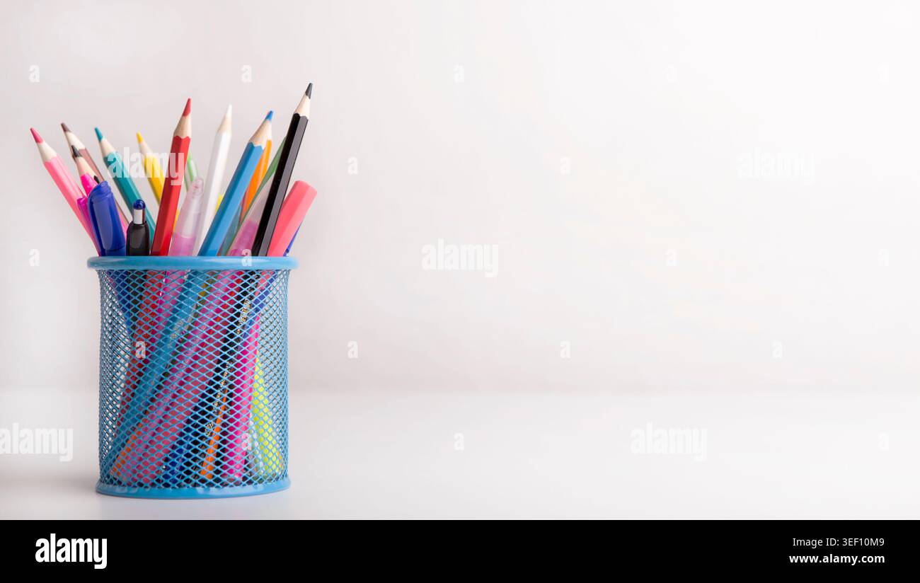 Box with colored pencils isolated on white background Stock Photo