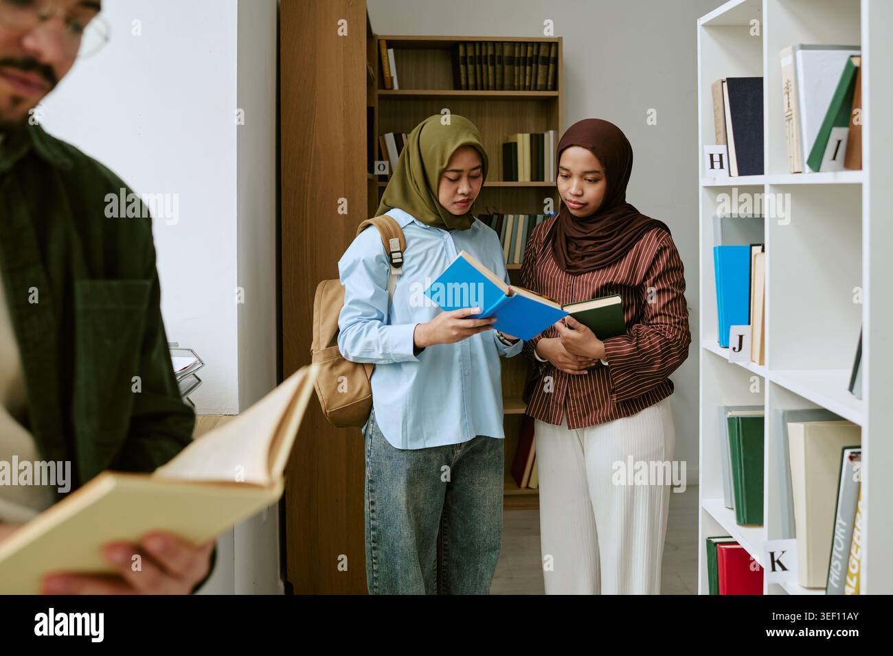 Muslim Students Studying Together in Library for Education Support Stock Photo
