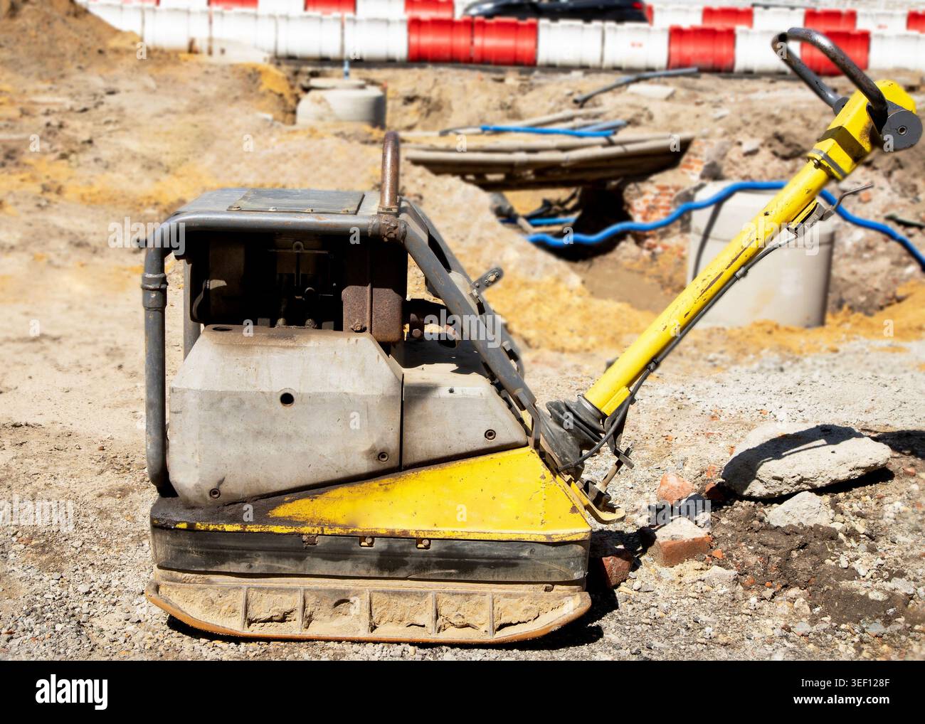 Heavy duty vibratory plate compactor equipment on sand ground at city ...