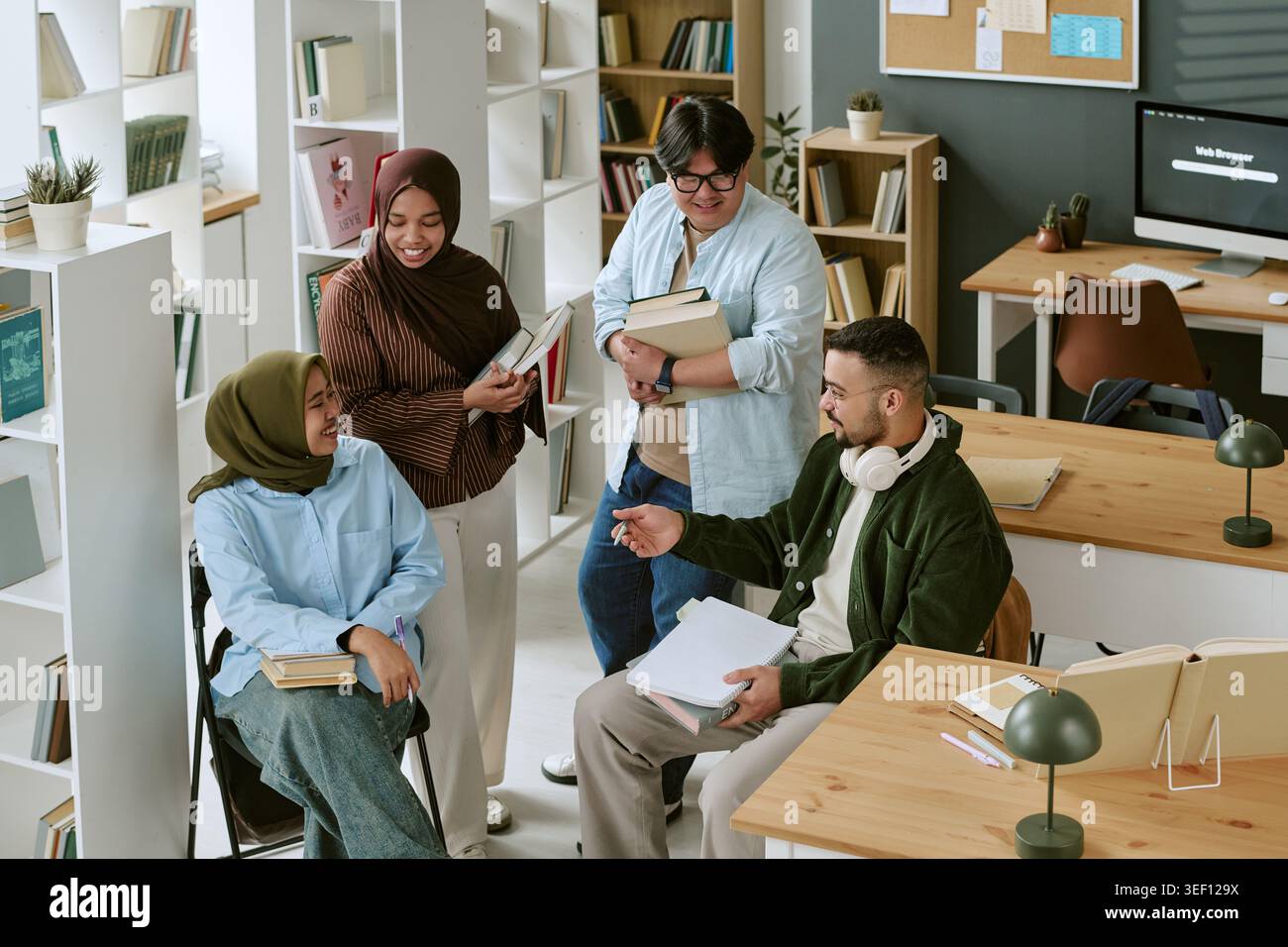 Diverse College Students Studying Together for Migrant Education Stock Photo