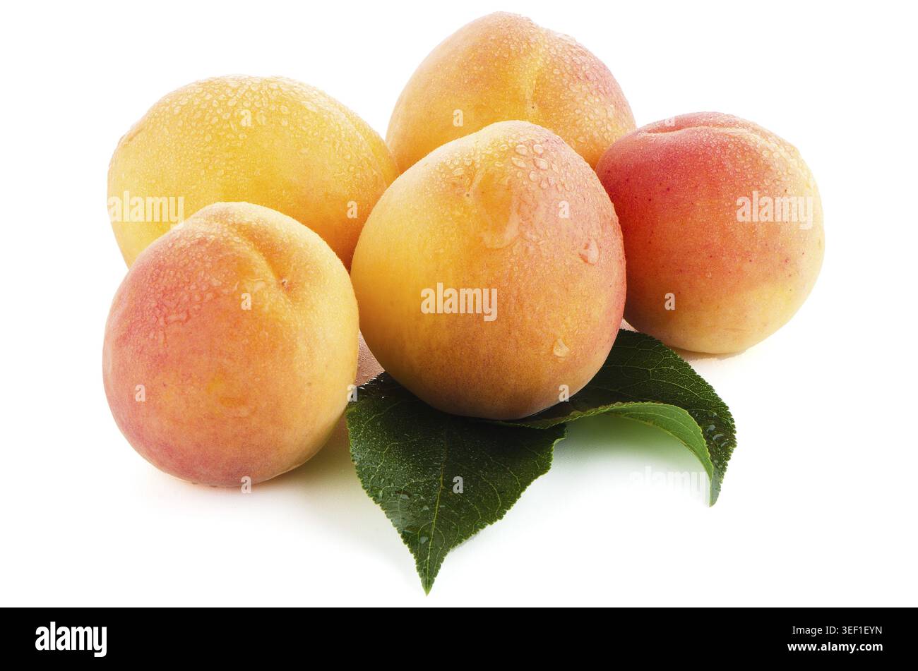 Sweet peaches with leafs on a white background Stock Photo