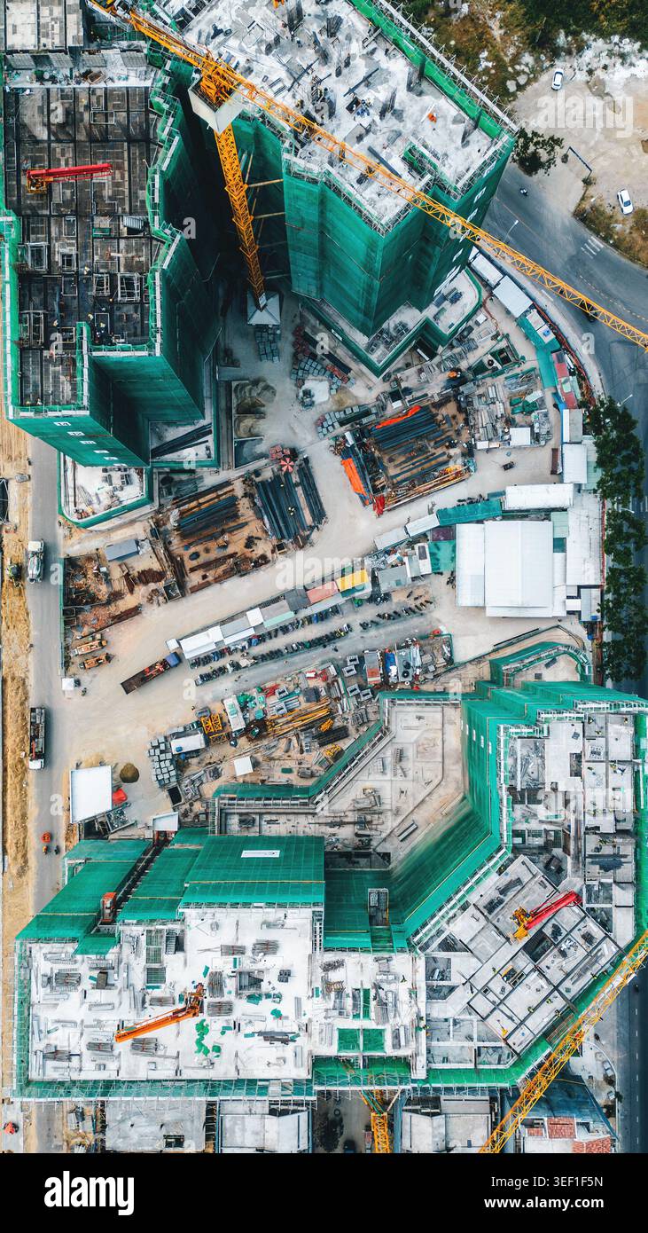 construction site with cranes and high-rise buildings under development ...
