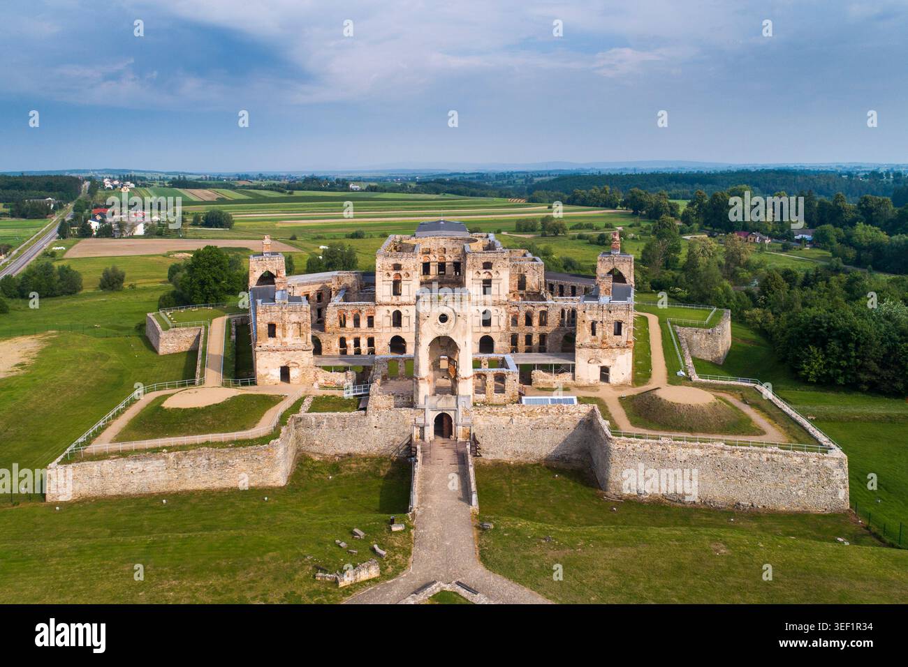 Large stone castle with multiple towers and walls, surrounded by a moat ...