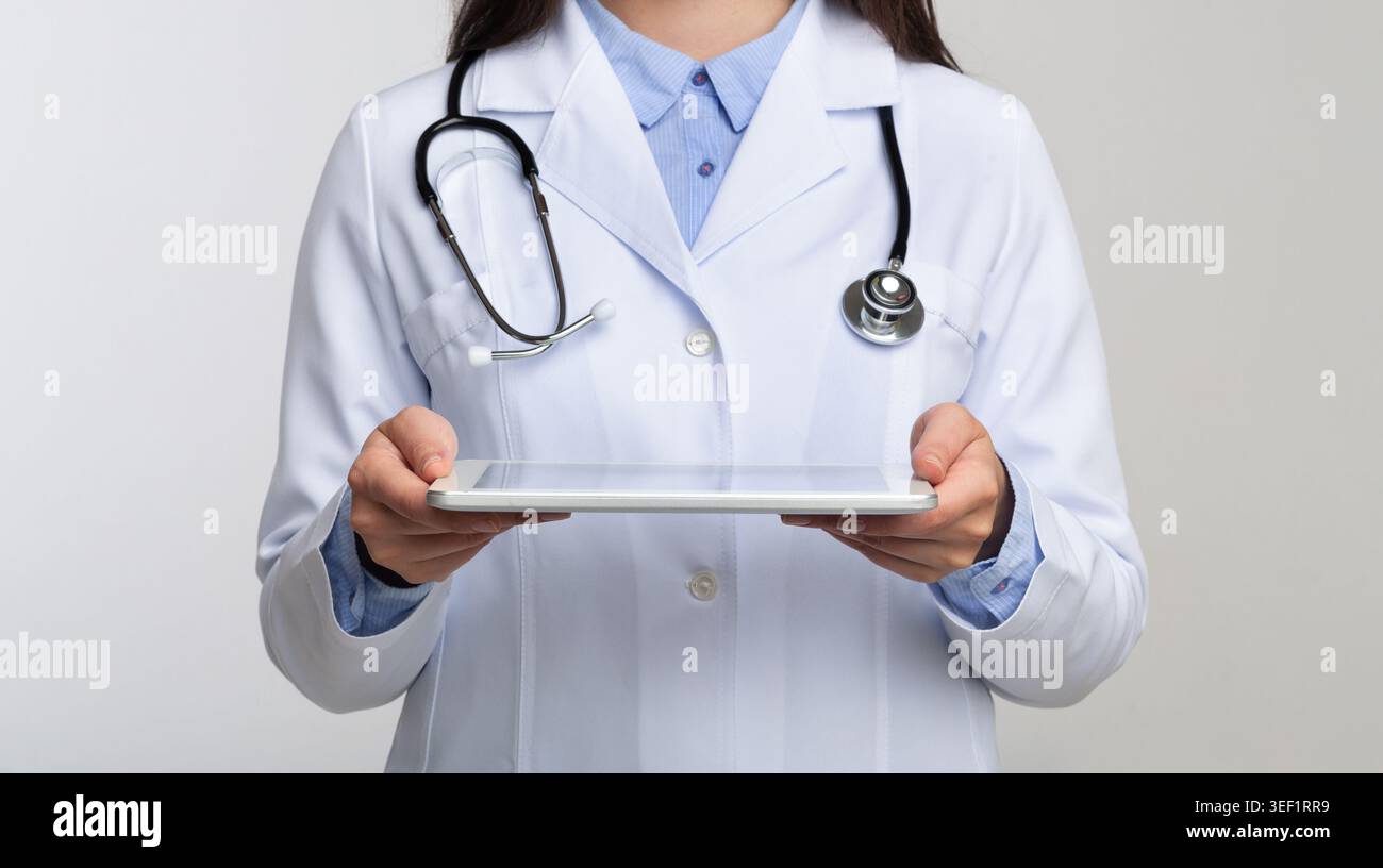 Unrecognizable Doctor Holding Tablet Standing In Studio, Panorama Stock Photo