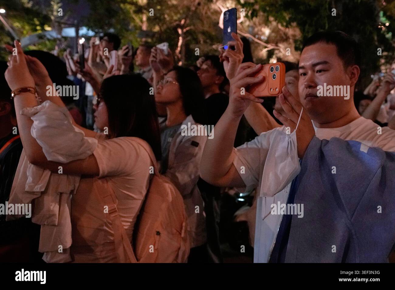 Residents use smartphones to film U.S. President Donald Trump's ...
