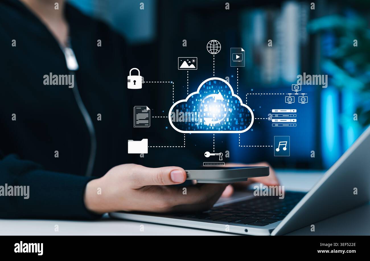 Cloud data sync and secure digital file storage concept. Person using phone and laptop with virtual cloud computing upload icon, documents, folders, Stock Photo