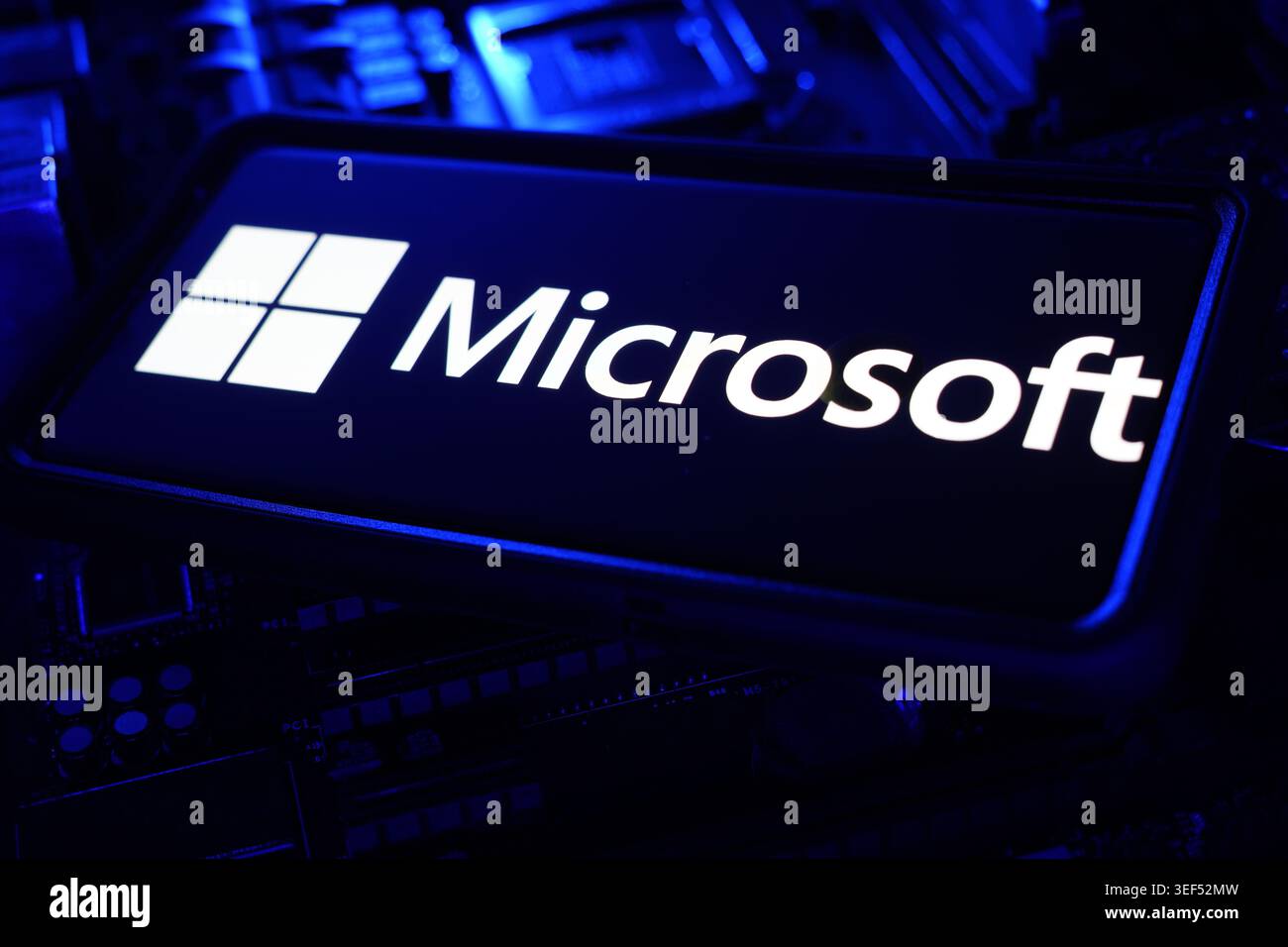 Microsoft Technology Company Logo Displayed On Digital Screen With Global Software And Cloud Computing CPU Motherboard Chips Background Stock Photo