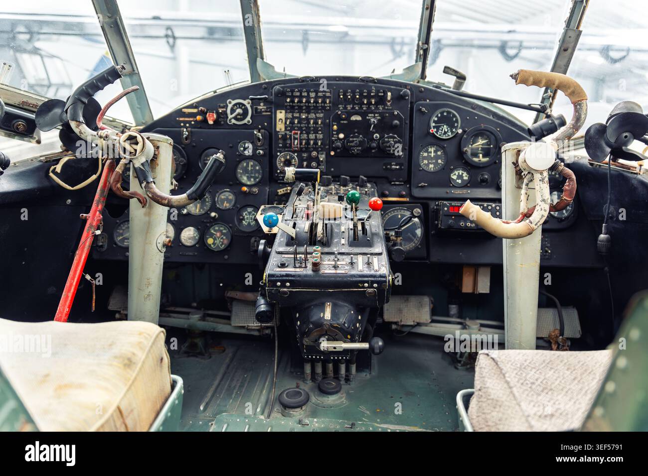Vintage aircraft cockpit interior analog instruments, control levers ...