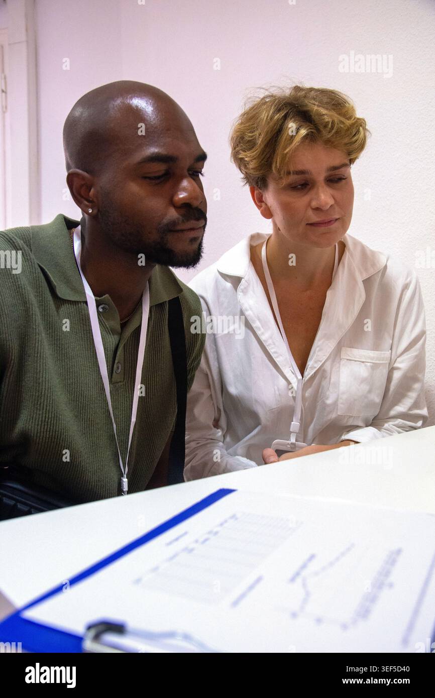 Colleagues collaborating on data analysis during a business meeting Stock Photo