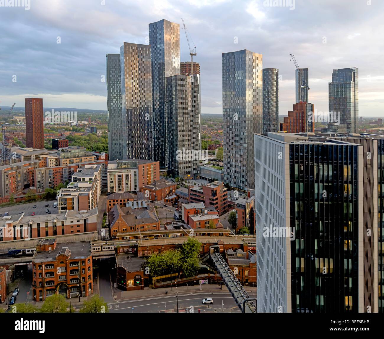 Manchester skyline looking south over Deansgate Square towers at sunset, with Trafford beyond, Greater Manchester, UK Stock Photo