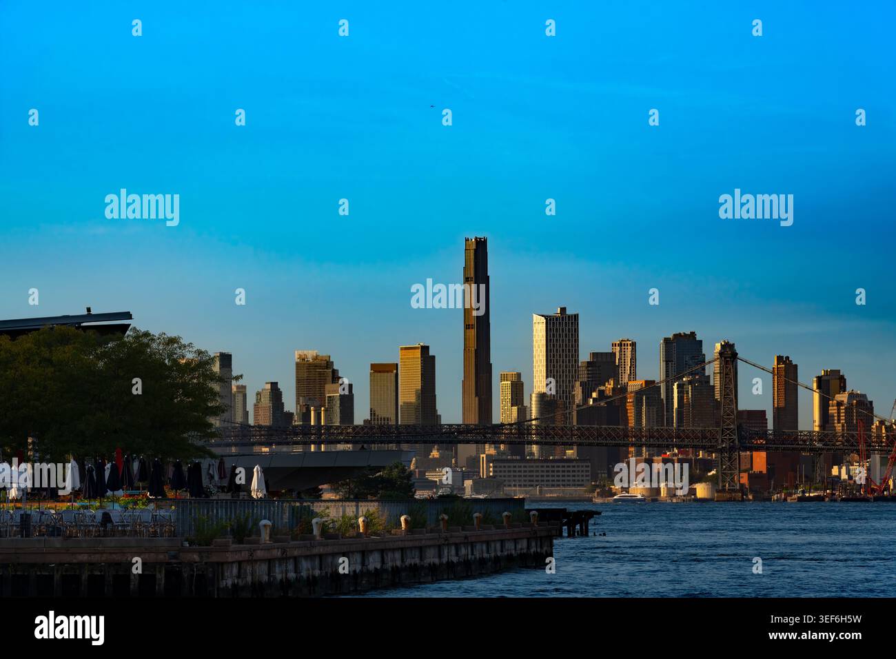 The massive skyscrapers of Brooklyn rise prominently behind the steel ...