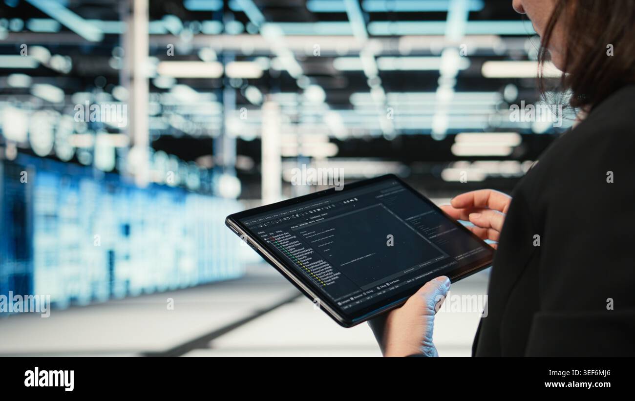 Using coding application, tablet and programmer in data center optimizing equipment rigs. Adjusting system parameters, programming script close up and IT professional in server hub camera A Stock Photo
