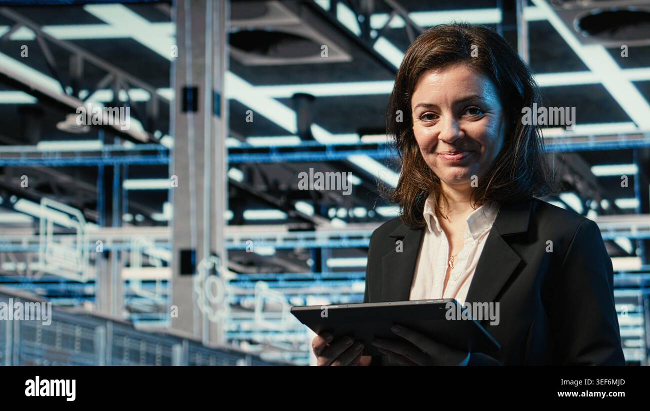 Close up of data center DevOps engineer optimizing server load balancing using tablet. Server farm worker adjusting system parameters on device to improve efficiency Stock Photo