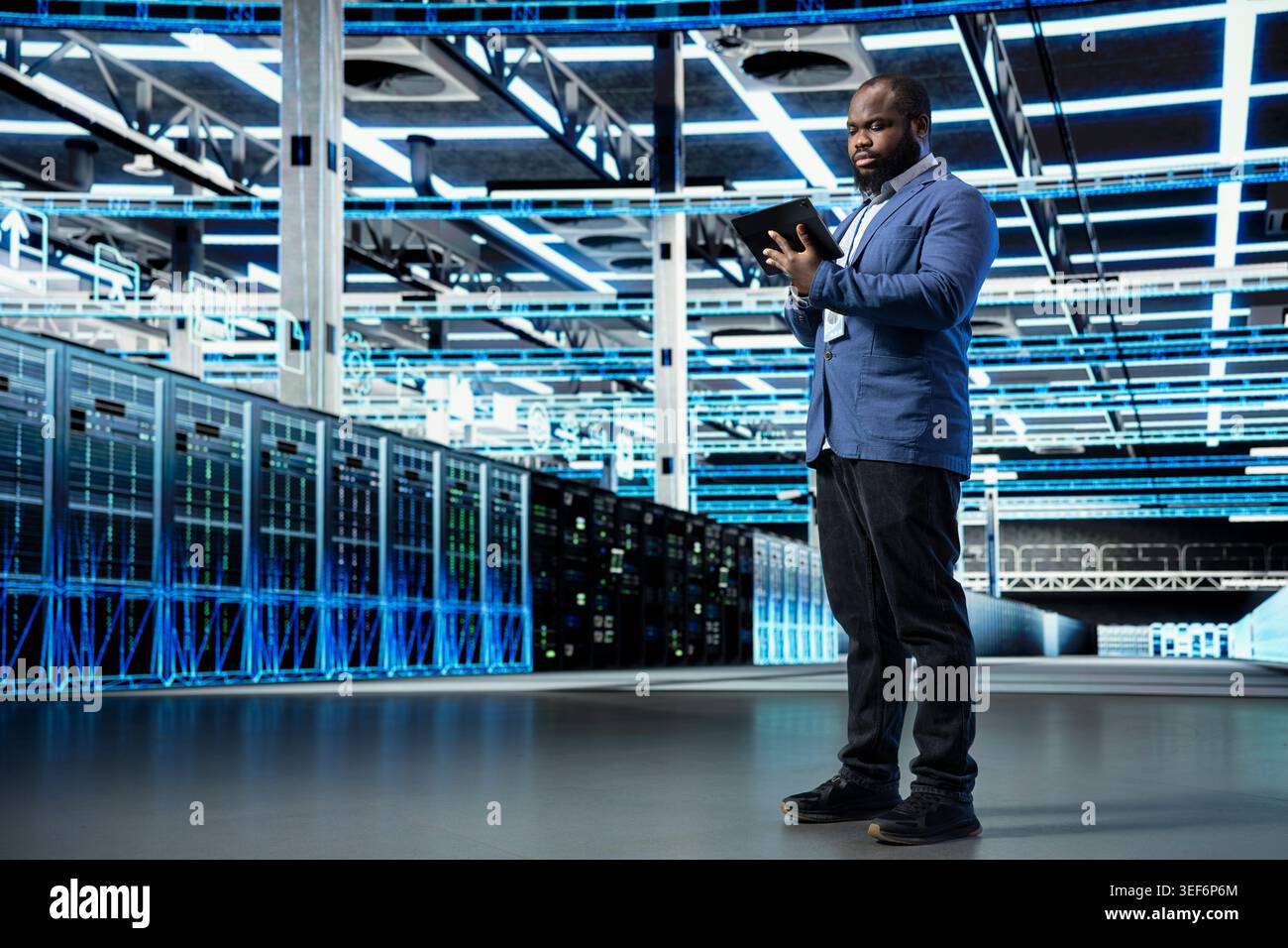Data center programmer reviewing network configuration with tablet, running predictive maintenance. African american man in server farm scanning hardware logs, tracking computer bugs using notebook Stock Photo