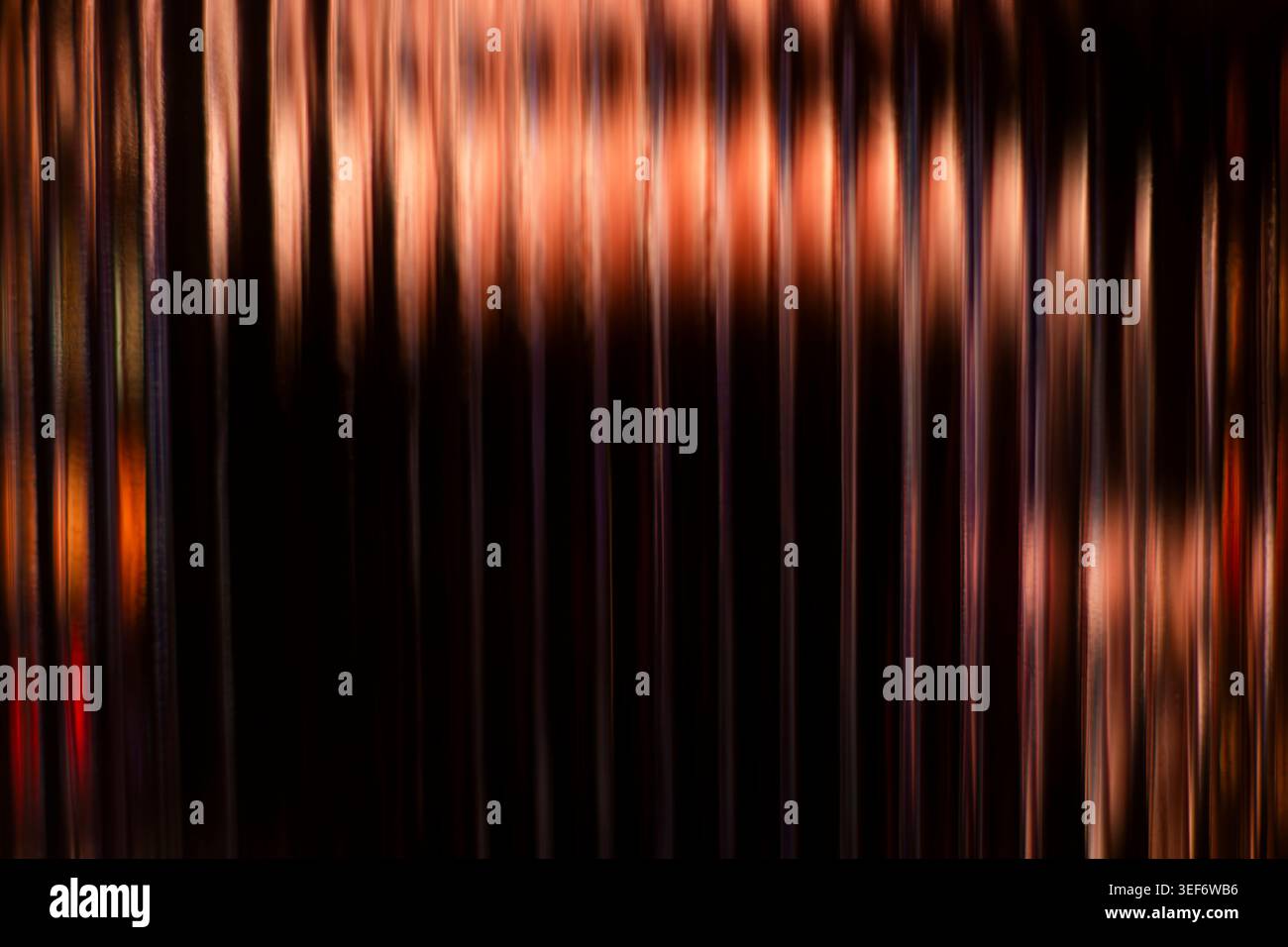 Abstract vertical copper and bronze glowing light streaks background Stock Photo
