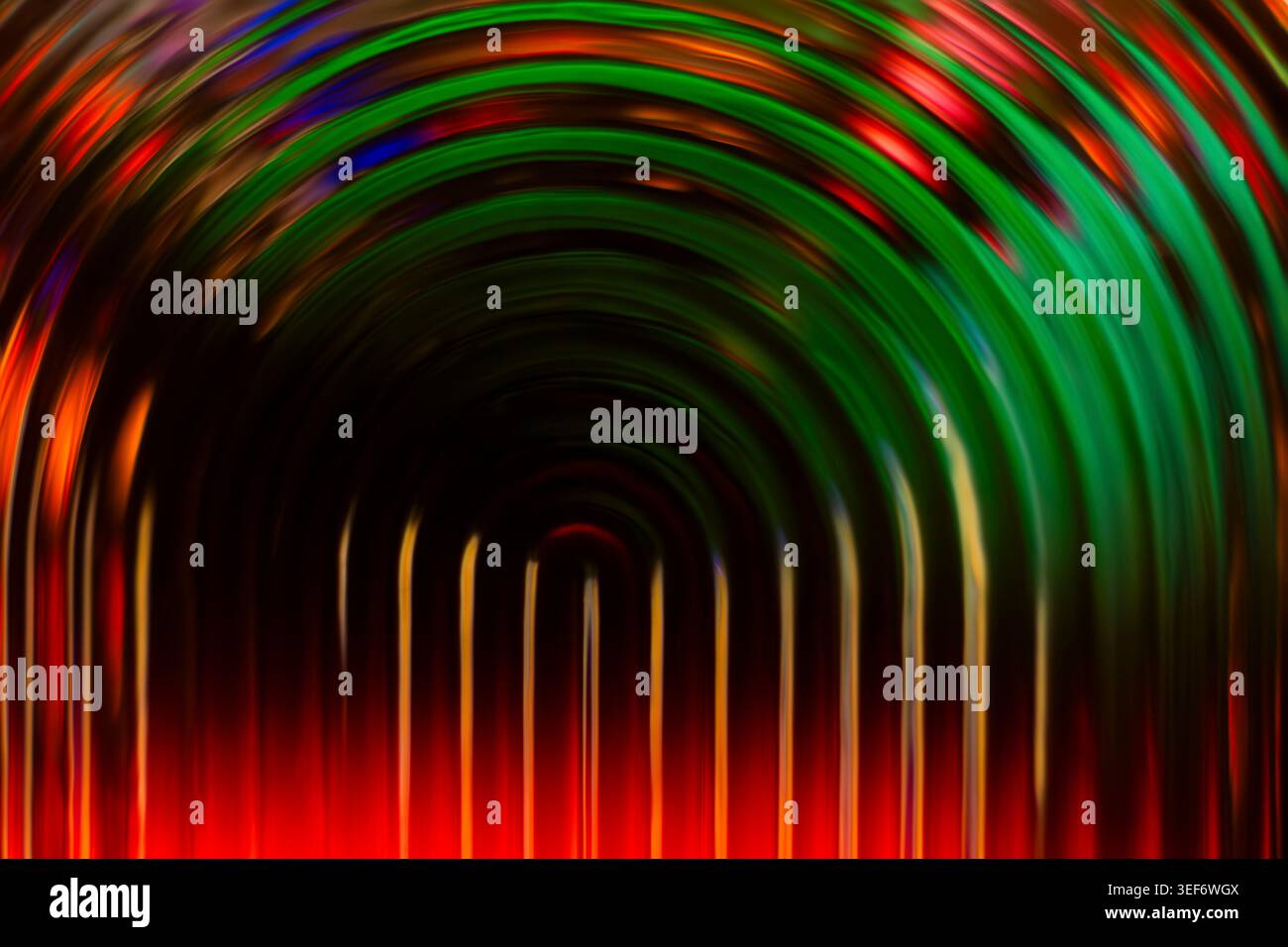 Colorful red and green glowing concentric arch lines on a dark background Stock Photo