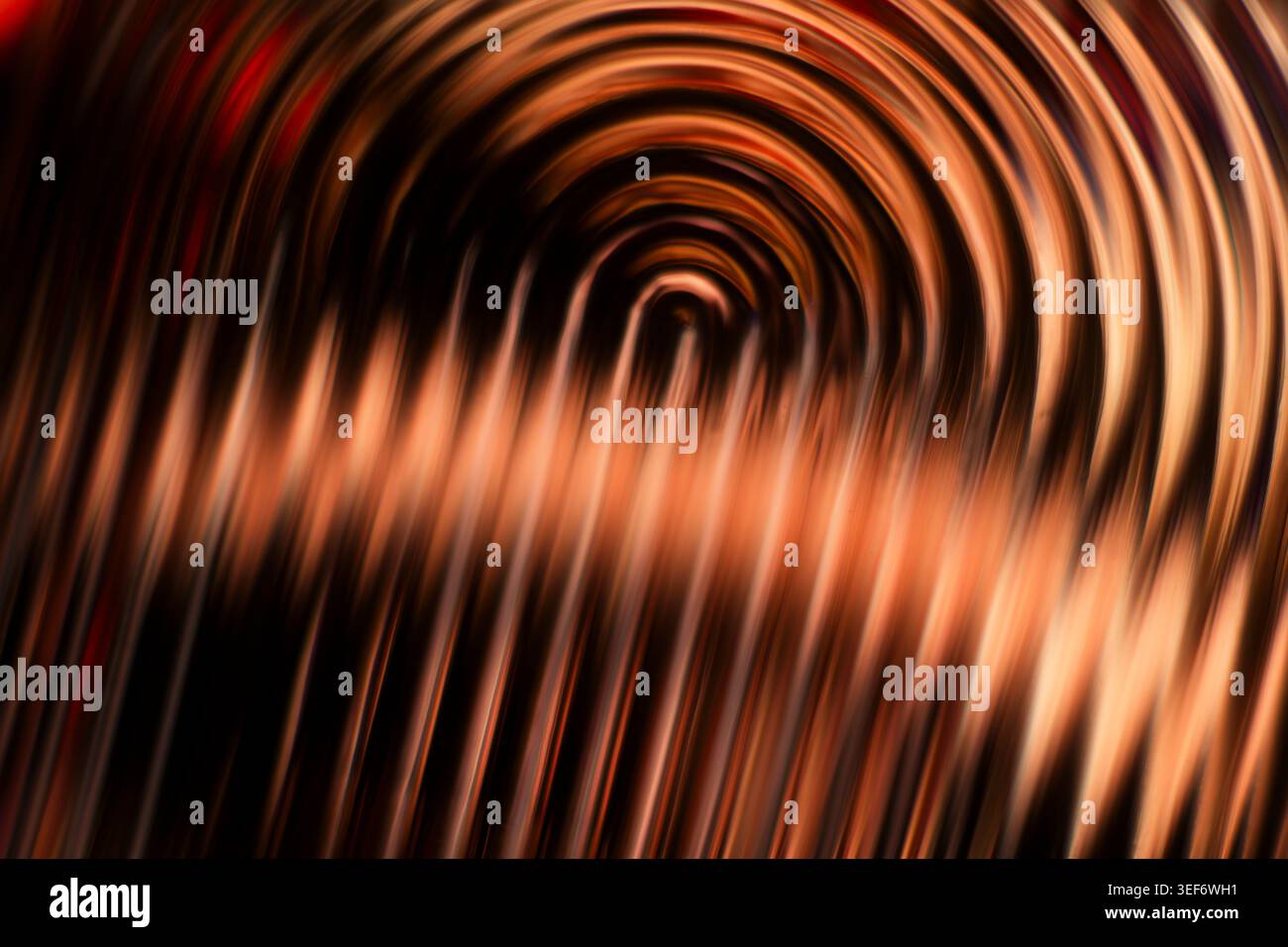 Copper and bronze abstract glowing circular motion blur texture Stock Photo
