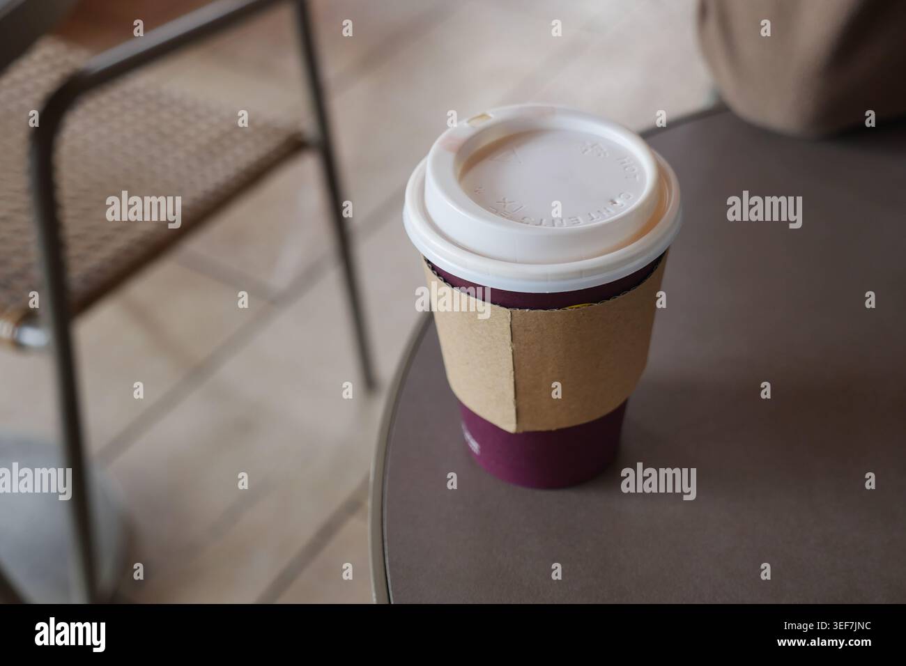 Warm drink sits on table in a cozy cafe setting Stock Photo