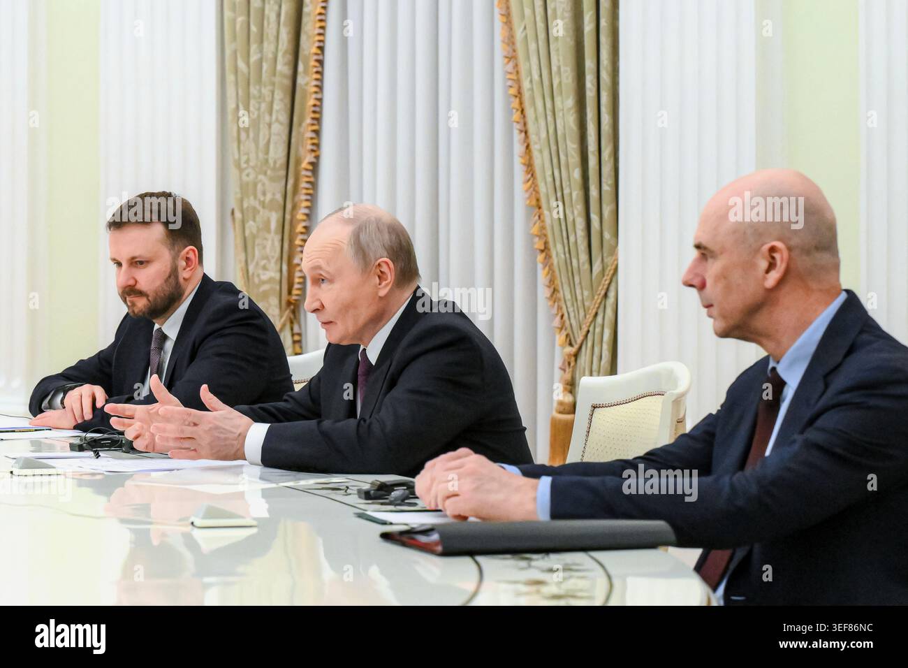 Russian President Vladimir Putin, center, Deputy Chief of Staff of the Presidential Executive Office Maxim Oreshkin, left, and Russian Finance Minister Anton Siluanov, attend a meeting with Dilma Rousseff, former Brazil President and current President of the New Development Bank, at the Kremlin in Moscow, Wednesday, May 13, 2026. (Pelagiya Tikhonova/Sputnik, Kremlin Pool Photo via AP) Stock Photo