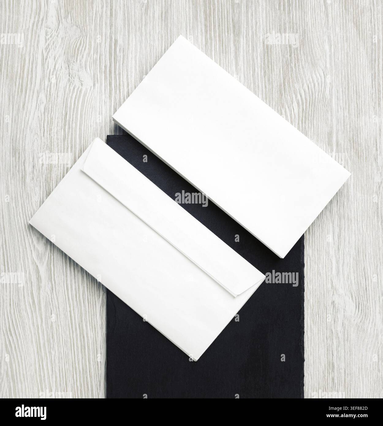 Two blank envelopes. Front and back side. Template for branding identity. Top view. Flat lay Stock Photo