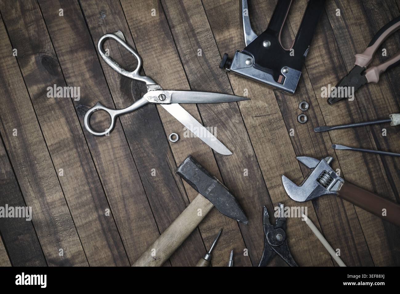 Different old tools on vintage wooden background. Flat lay Stock Photo