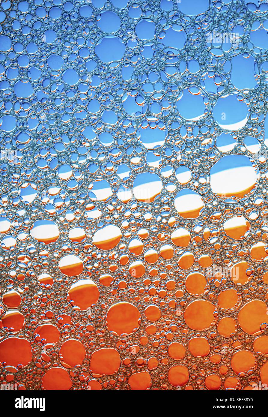 Blue and orange bubbles background. Foam bubbles macro texture Stock Photo