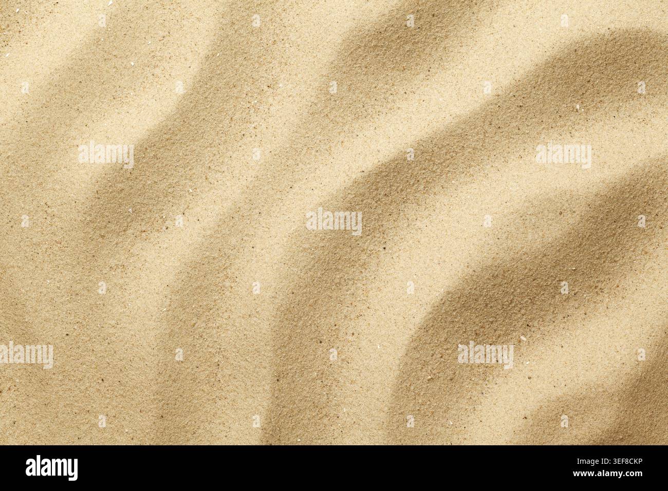 Wavy sand background for summer designs. Flat lay, top view Stock Photo