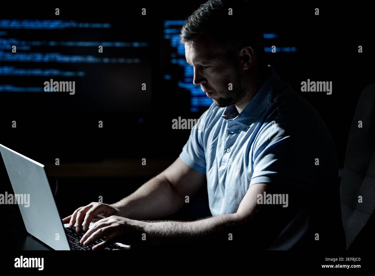 Malware hacker develops malicious software. Malware hacker infects computer network. Malware hacker bypasses security system. Malware hacker spreads Stock Photo