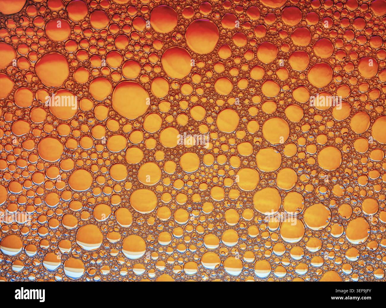 Orange bubbles background. Foam bubbles macro texture Stock Photo